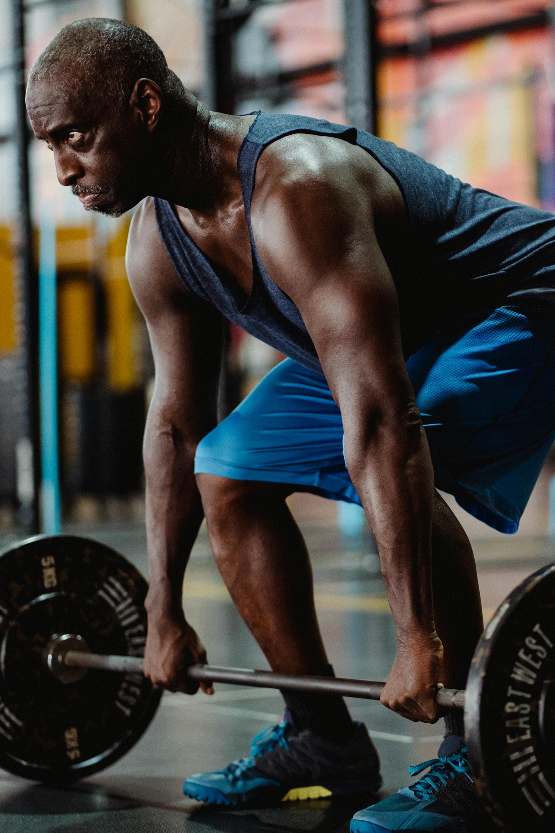 Athlete training with weights in a gym